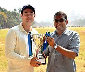 Som Sundaresan presents the Capital Markets Cup to Jamie Benson