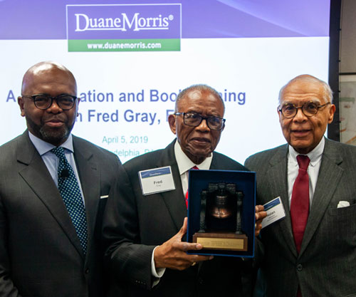 Fred Gray (center) stands with Joseph K. West (left) and Nolan N. Atkinson, Jr.